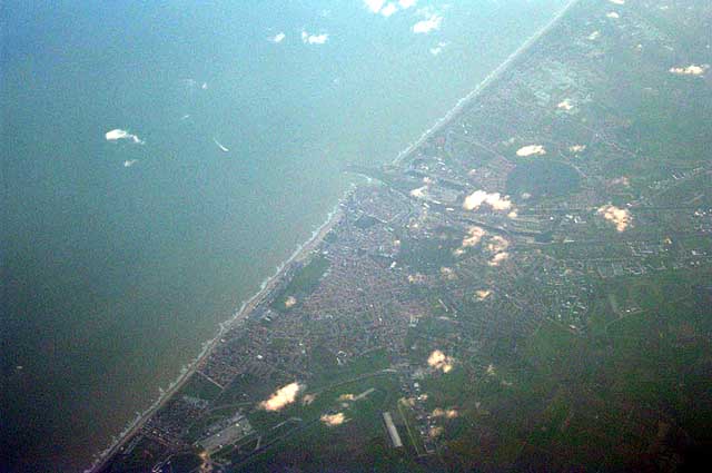 You can see the wake of a ferry boat approaching the mouth of the river.